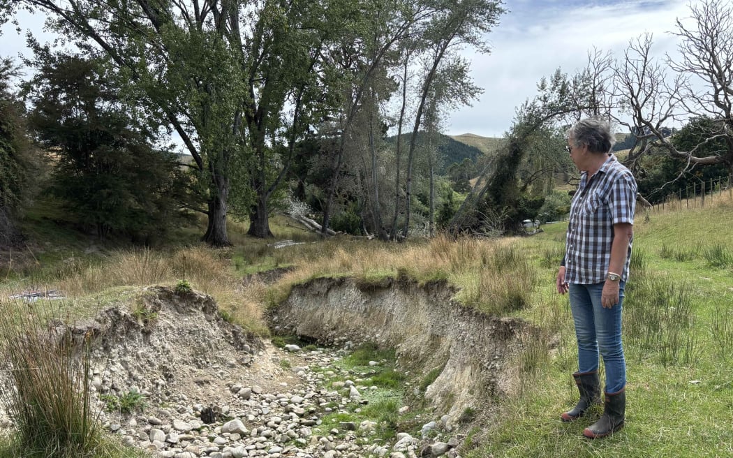 The_2025_floods_have_left_large_patches_of_land_scoured_out_on_Arthur_and_Debbie_Win's farm_in_Dovedale
