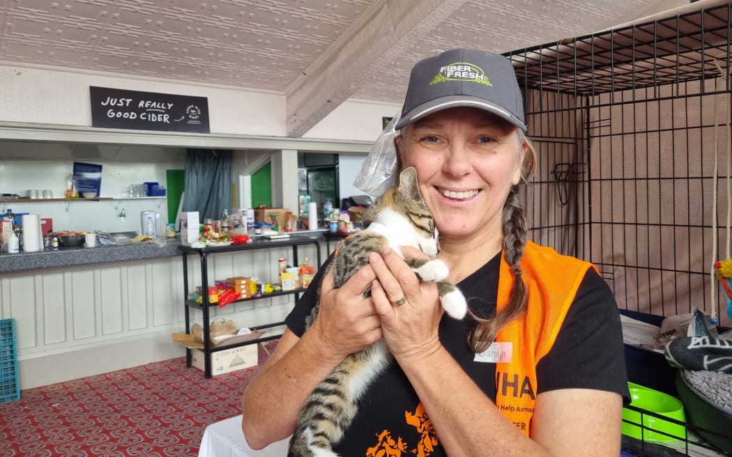 Carolyn Press-McKenzie and a kitten.
