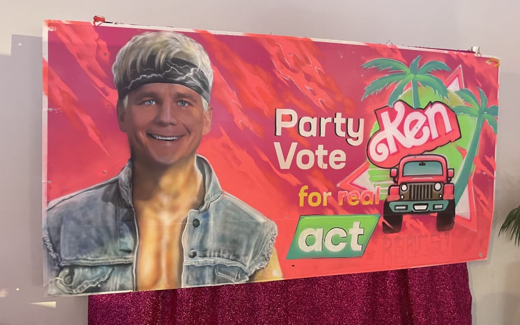At ACT's election night event at Auckland's Viaduct, an election hoarding has been repurposed as a photo backdrop, featuring Seymour as the character Ken from the Barbie movie.