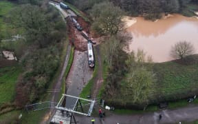 A sinkhole has developed in a canal in the county of Shropshire, England, prompting rescue operations.