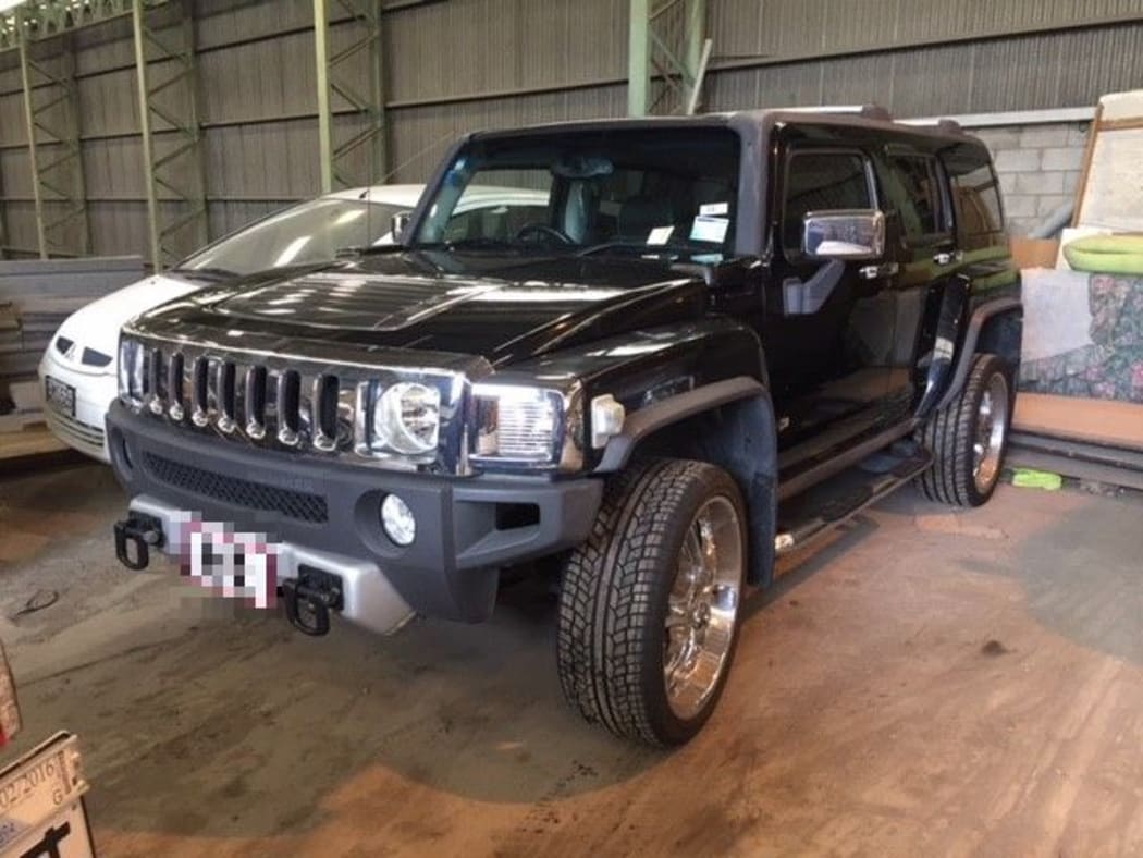 Police seized multiple assets including a Hummer.