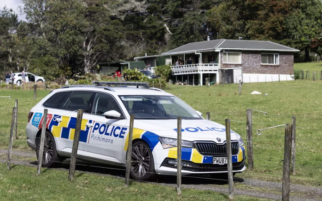 Police at the Hansens' Anzac Valley Rd property in West Auckland, where they were found dead. Photo / Jason Oxenham