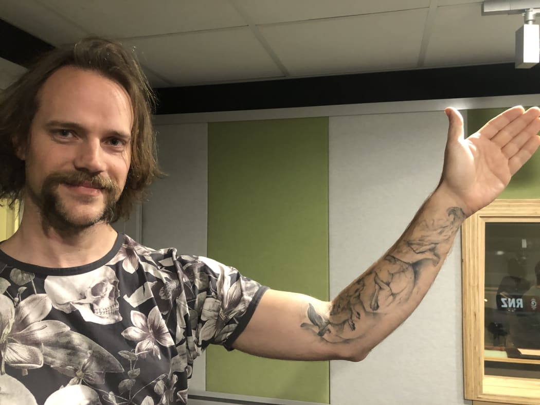 Dr Andrew Veale and his stoat tattoo