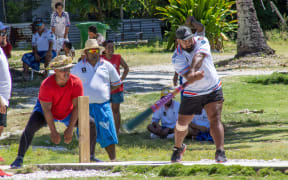 A batsman for Amelika connects with the ball for six.