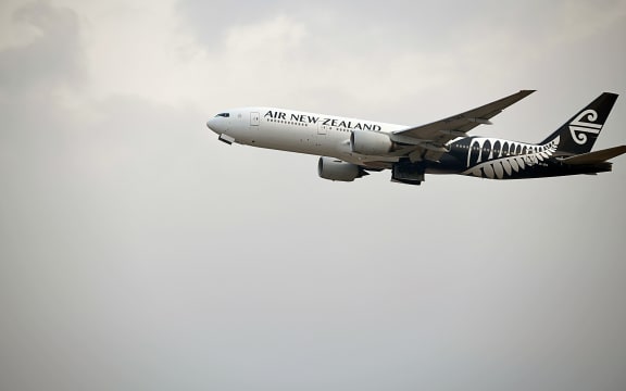 air new zealand boeing 777-219 inflight mid-air after taking off from hong kong international airport on chek lap kok island.