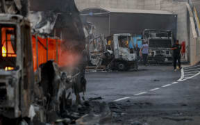 Burnt trucks after an attack by Israeli settlers in the village of Beit Lid, east of Tulkarm in the occupied West Bank, on November 11, 2025. Violence in the West Bank has surged since the outbreak of the Gaza war in October 2023, with frequent settler assaults on Palestinian towns and property. (Photo by Mohammad Nazal / Middle East Images via AFP)