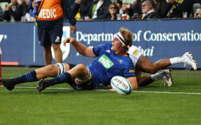 Sam Darry of the Blues scores a try during the Super Rugby Pacific match between the Auckland Blues and Fijian Drua at AAMI Park in Melbourne.