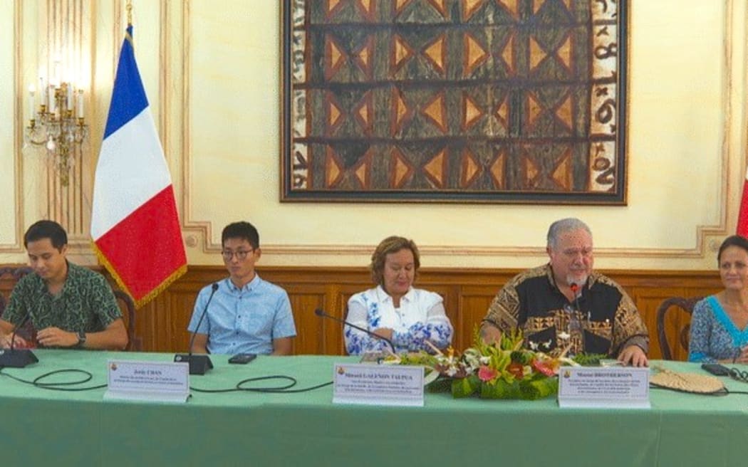French Polynesia's President Moetai Brotherson (second right) appoints Oraihoomana Teururai (left) minister for land and housing