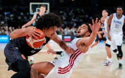 Tall Blacks Guard Tai Webster (L) dribbles against the Philippines.