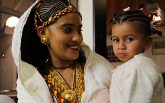 Mother and daughter dressed for Ashenda