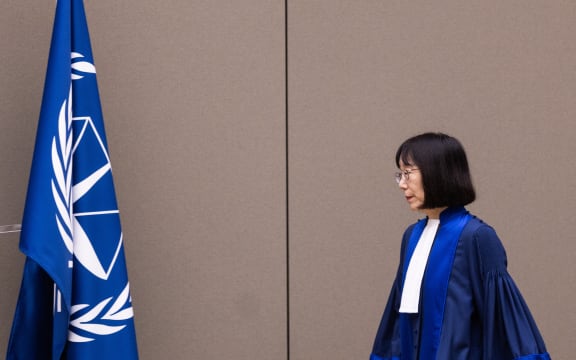 Judge Tomoko Akane arrives prior to the announcement of the International Criminal Court (ICC) verdict that sentenced Malian Jihadist police chief Al Hassan Ag Abdoul Aziz Ag Mohamed Ag Mahmoud to 10 years in jail for war crimes and crimes against humanity committed during a reign of terror in the fabled Malian city of Timbuktu, on November 20, 2024 at the ICC court in The Hague. - ICC judges had convicted Al Hassan Ag Abdoul Aziz Ag Mohamed Ag Mahmoud, 47, in June for crimes including torture when he was a member of the feared Ansar Dine Islamic militant group that seized control of Timbuktu for almost a year from early 2012. (Photo by Eva Plevier / various sources / AFP) / Netherlands OUT / NETHERLANDS OUT