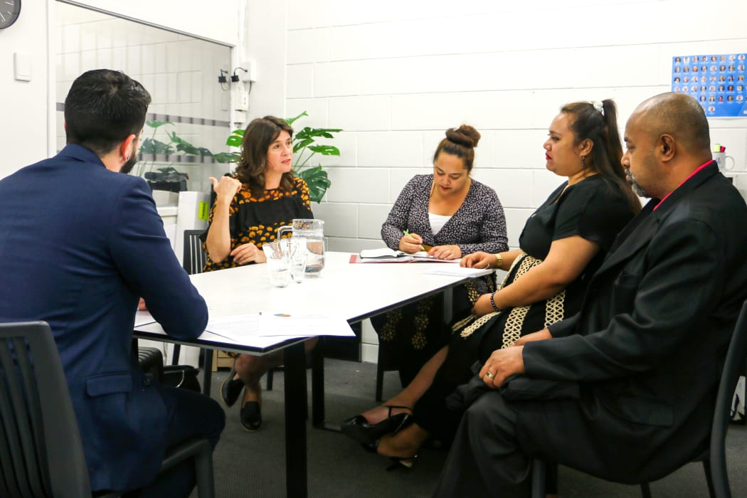 MP for Maungakiekie Denise Lee talks with Tongan parliamentary staff in her Auckland office