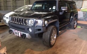 Police seized multiple assets including a Hummer.