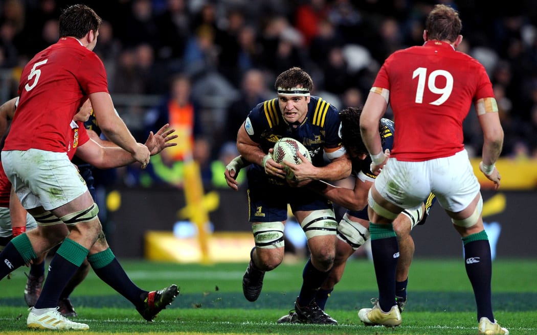 Luke Whitelock of the Highlanders looks for a gap in the Lions' defense.