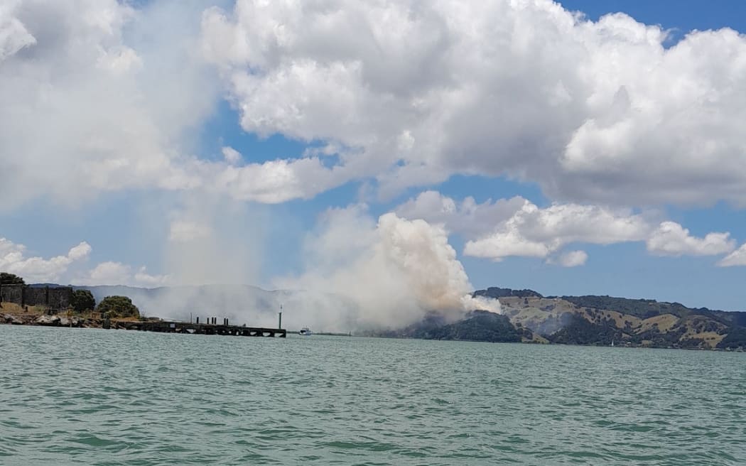 Smoke at Whangārei Heads from a vegetation fire can be seen from the water.