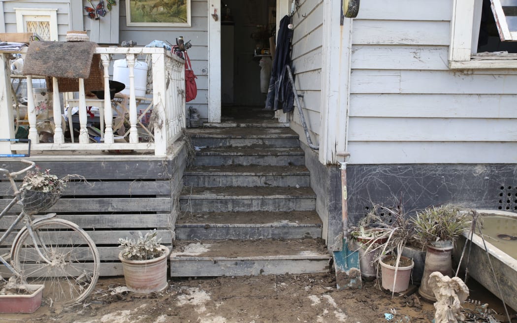 The exterior of Jeanette Mitchell's house was left coated in mud after the flood.