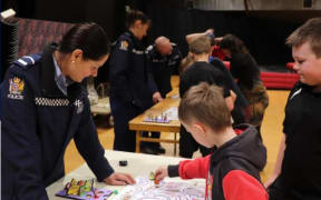 Senior constable Rosie Marchant watching tamariki play her game