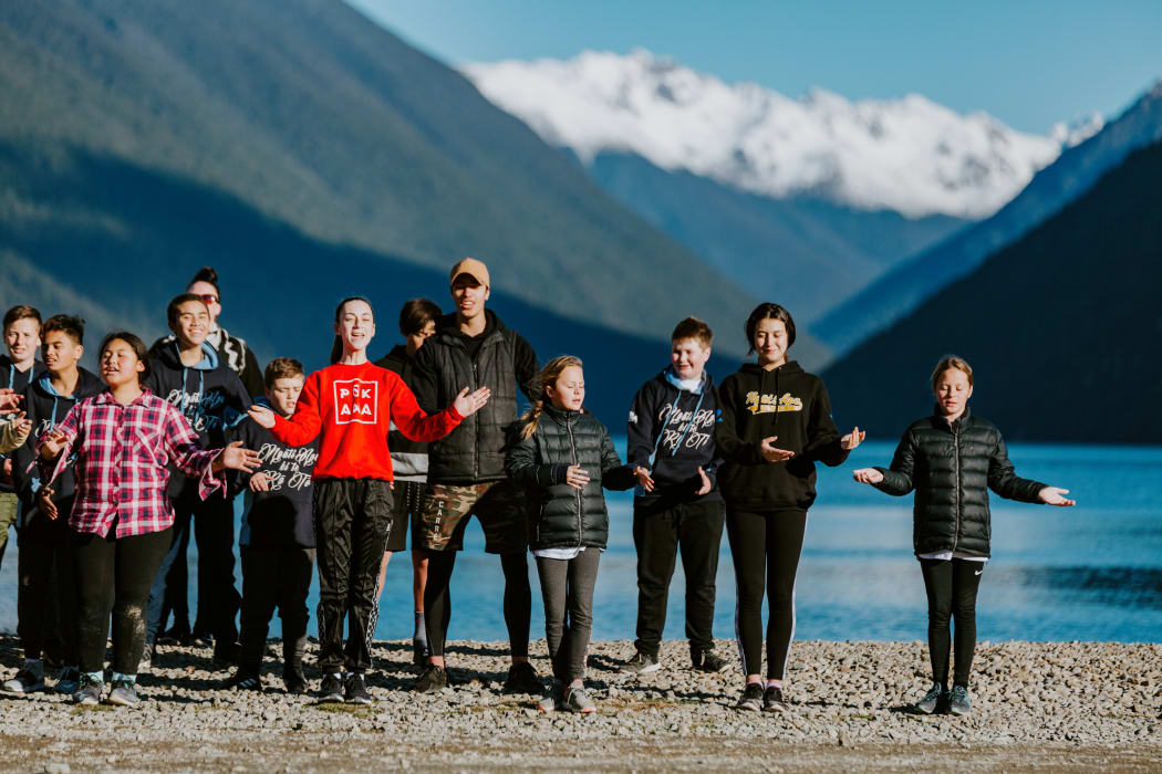 Young people take part in a Ngāti Apa iwi Rangatahi programme on the shores of Lake Rotoiti at a winter wānanga.
