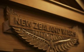 A plaque unveiled in Parliament, commemorating the New Zealand Wars.