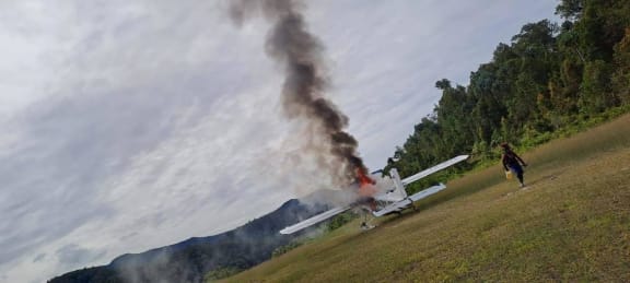 The Susi Air plane that Phillip Mehrtens was piloting being torched by the rebels