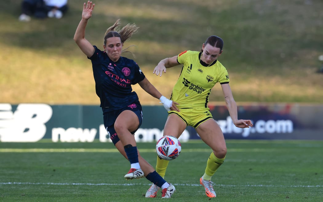 Phoenix Mackenzie Barry (R with Melbourne City Leticia Mckenna during the A-League Women - Wellington Phoenix v Melbourne City FC at Porirua Park, Wellington on the 30 March 2025