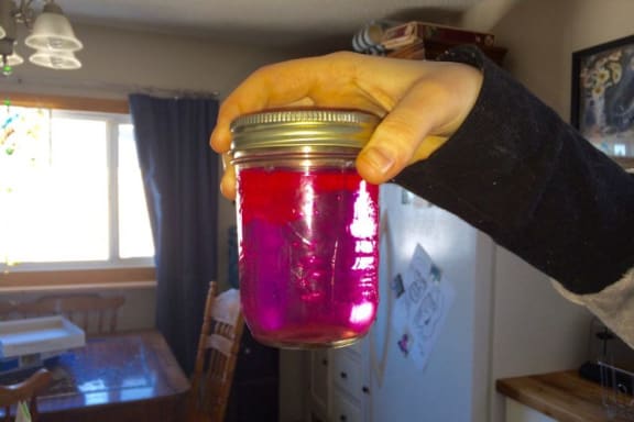 Pink water in a jar
