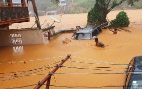 This handout picture released on August 14, 2017, by Society 4 Climate Change Communication Sierra Leone, shows flooded streets in Regent near Freetown.