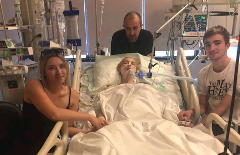 New Zealand mother Abby Hartley in a Bali Hospital with her children, Sophie and Toby, and husband, Richard.