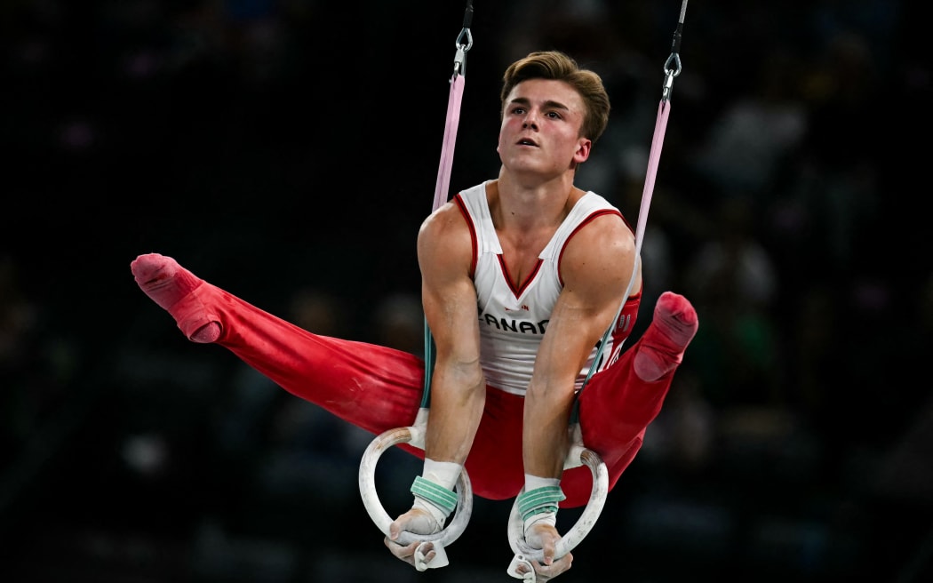 Canada's Felix Dolci competes in the rings event of the artistic gymnastics men's qualification during the Paris 2024 Olympic Games at the Bercy Arena in Paris, on July 27, 2024. (Photo by Paul ELLIS / AFP)