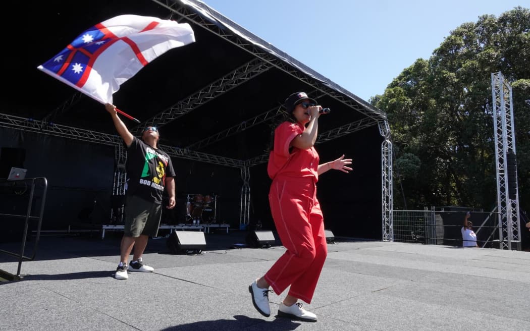 Ladi6 on the main stage with her brother-in-law and supporter Peter Pomale.