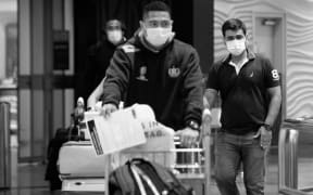 Travellers arrive at Auckland Airport amidst the Covid-19 pandemic