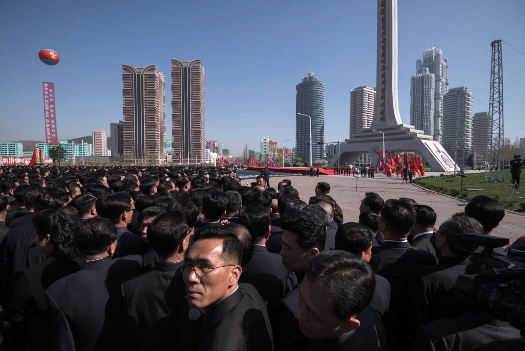Attendees wait for the arrival of North Korea's leader Kim Jong-Un at the opening ceremony for the Ryomyong Street housing development in Pyongyang.