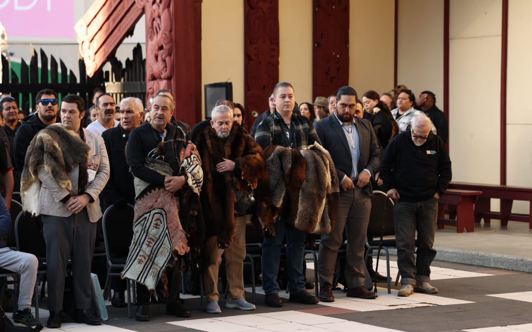 An Aboriginal delegation of possum skin cloak knowledge holders at a pōwhiri at Pipitea Marae in Wellington.