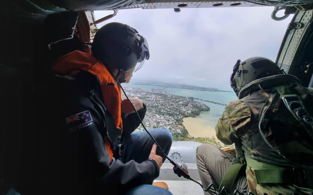 Prime Minister Chris Hipkins assesses the damage from the Auckland flooding from a helicopter on Saturday, 28 January.