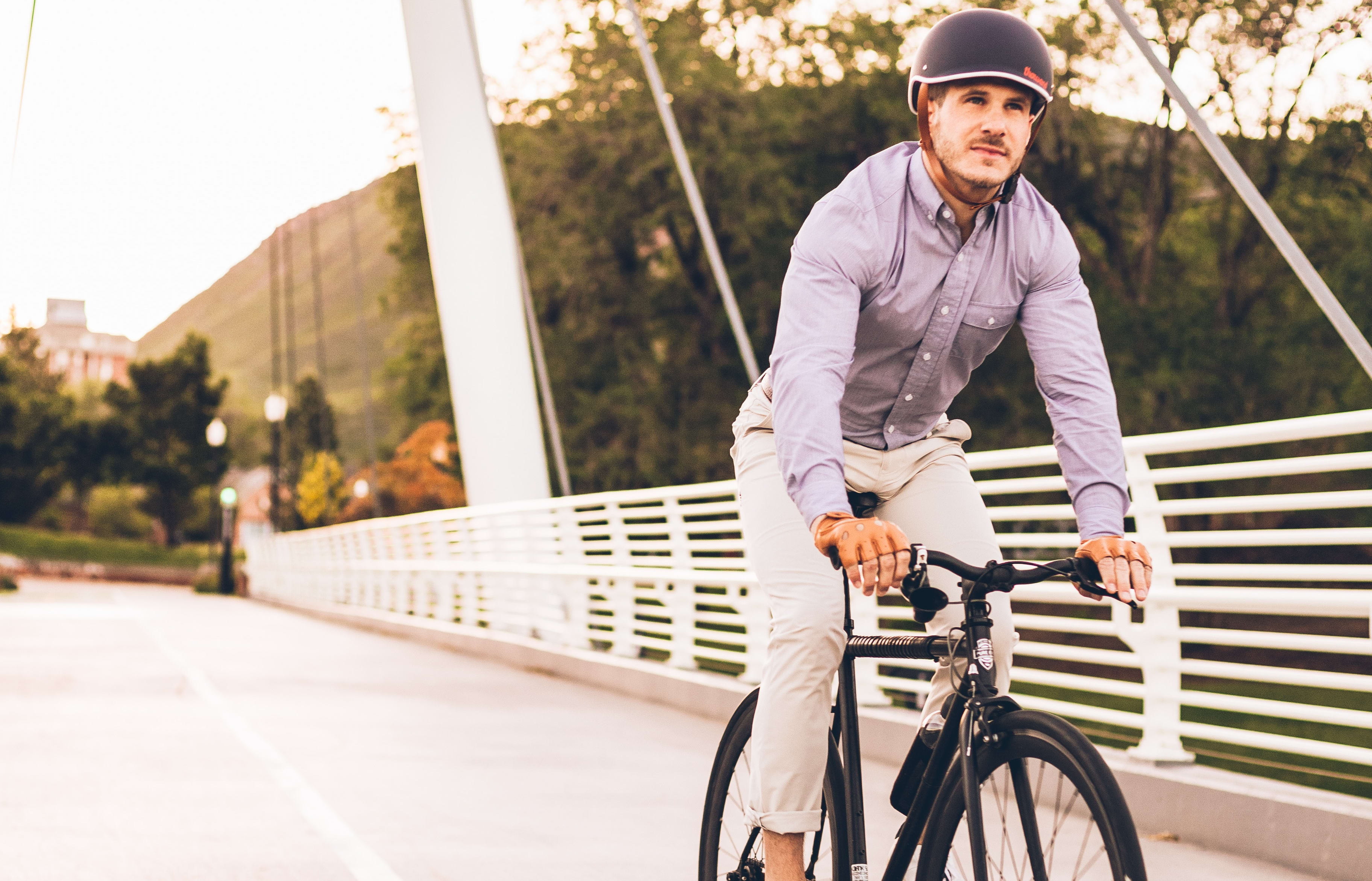 man on bike on bridge