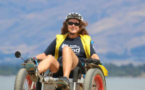Natalie Gauld on her Motom, designed by Bachelor of Engineering graduate Andrew Nash.