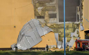 Rescuers put out the fire in an industrial facility after a massive Russian drones strike mainly targeting the Ukrainian capital, in Kiyv, on May 28, 2023. Russia carried out the "most important" drone attack on Kyiv in the night of May 27, since the start of the invasion, military authorities said. "In total a record number of explosive drones launched were counted: 54!" Ukraine's air force said in a Telegram post. Forty of the drones targeted the capital, killing two people and wounding three. (Photo by Sergei SUPINSKY / AFP)