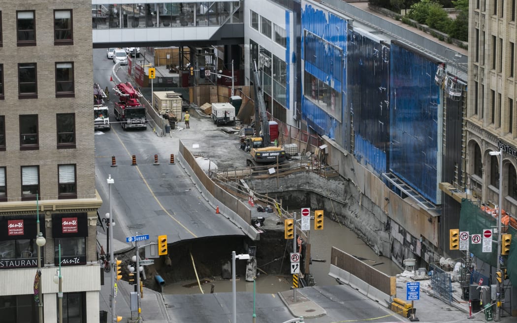 A large portion of Rideau Street, next to a shopping mall in downtown Ottawa, caved in and cut power to a majority of the city.