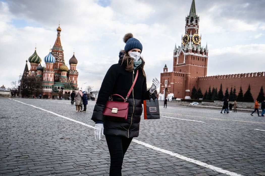 A young russian woman walk with a medical mask and gloves on the Red Square in Moscow. Moscow, march 2020.
Une jeune femme russe marche avec un masque medical et des gants sur la Place Rouge à Moscou. Moscou, mars 2020. (Photo by Tom Grimbert / Hans Lucas / Hans Lucas via AFP)
