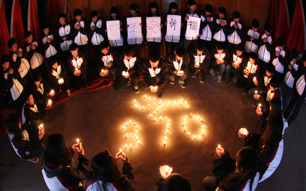 Students in Jiangsu province at a vigil for the missing passengers, many of whom were Chinese.