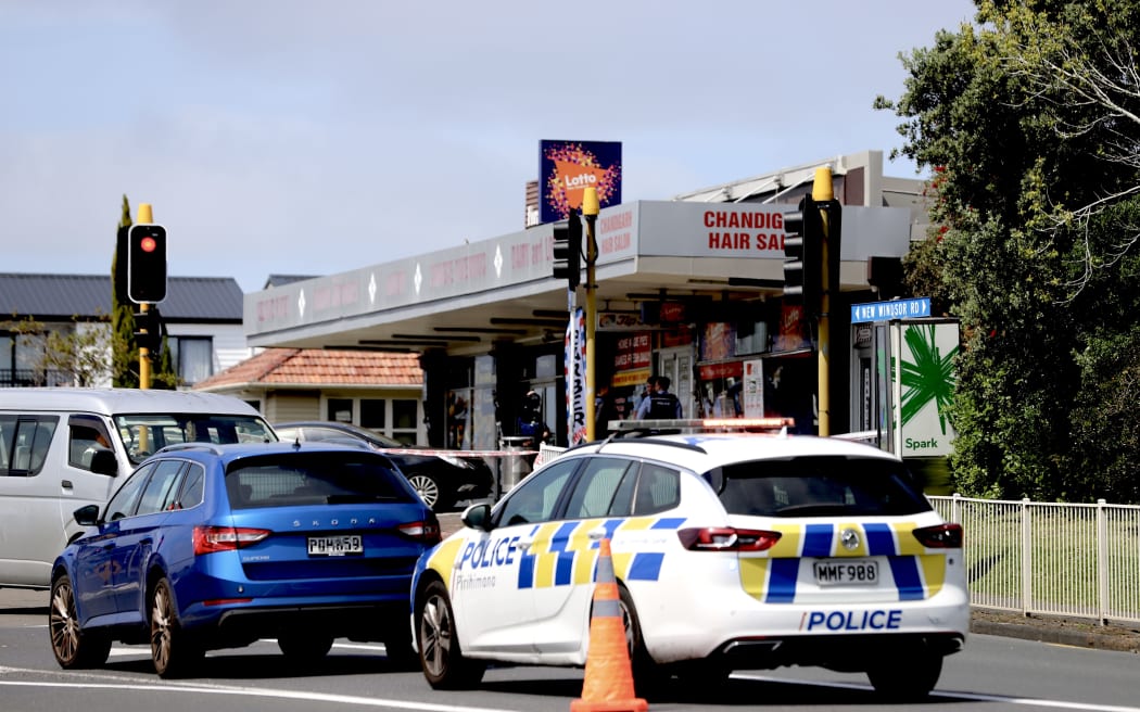 A police car outside the New Windsor dairy in Auckland.