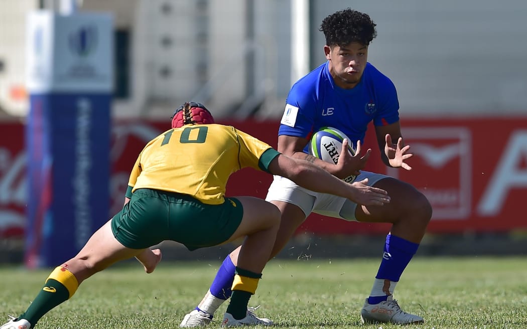 Samoa centre Hunter Paisami tests the Australian defence.