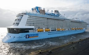 The new cruise ship of the Meyer dockyard in Papenburg, 'Ovation of the Seas', arriving in bremerhaven, Germany, 28 March 2016. After the first major test run on the North Sea, the 348 meter long ship will be finalised for the handover to the US-American shipping company 'Royal Carribean International'. PHOTO: INGO WAGNER/dpa (Photo by INGO WAGNER / DPA / dpa Picture-Alliance via AFP)