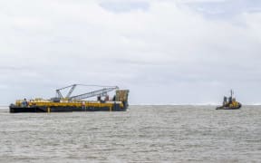 Barge as it was leaving the port of Apia for the South West coast of Samoa where the Manawanui sunk.