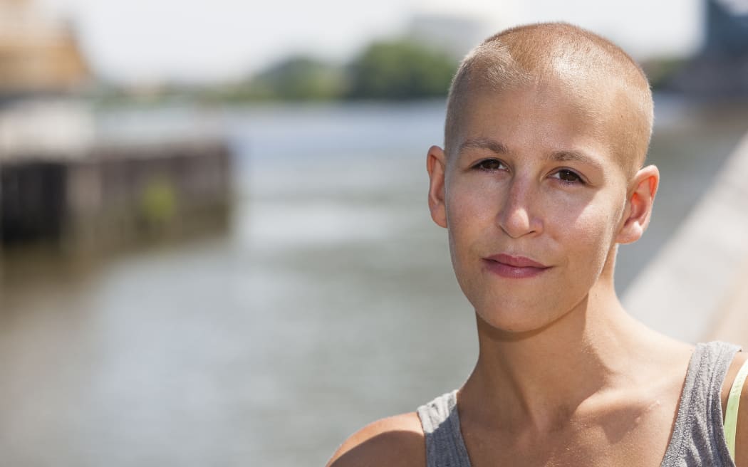 A portrait of a woman after treatment for cancer.