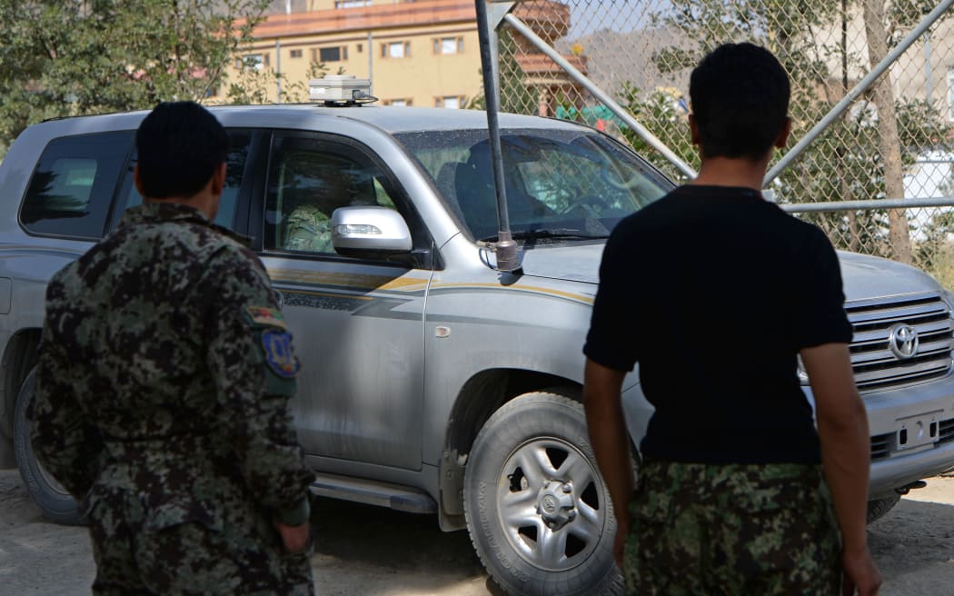 Soldiers keep watch at a British-run military academy near Kabul, where an Afghan soldier is reported to have opened fire on NATO troops.
