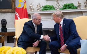 Scott Morrison and Donald Trump shake hands in the Oval Office during Morrison's official visit to White House last month.