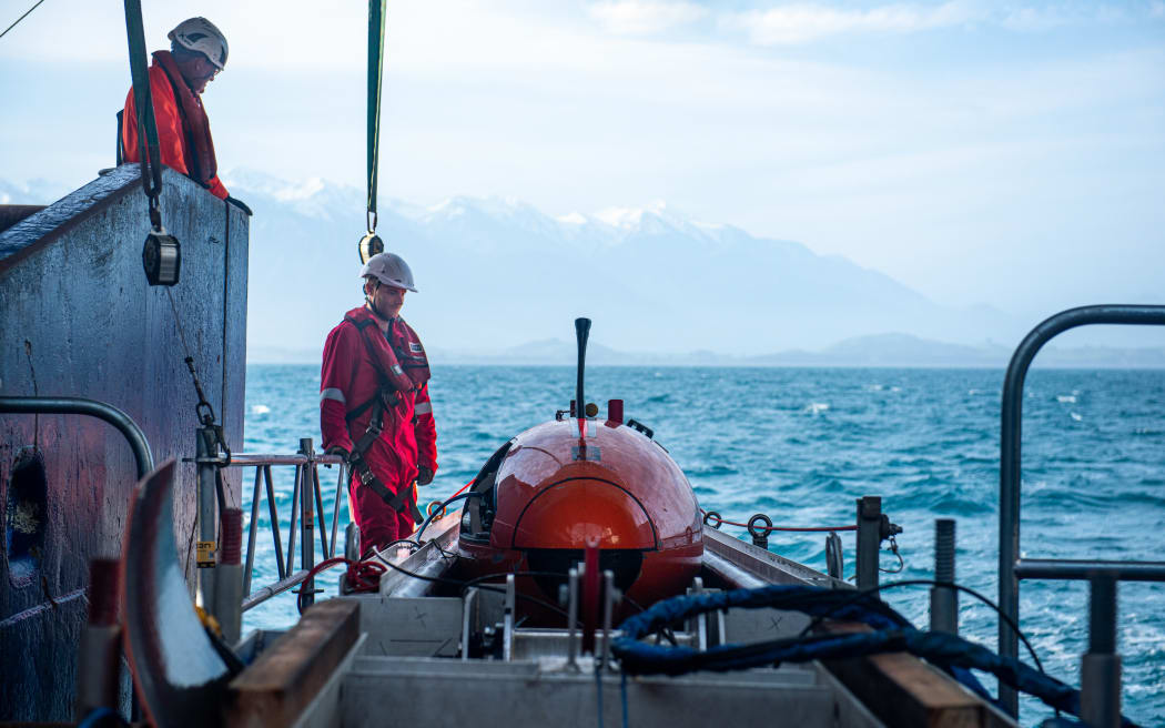 Barry Fleming (NIWA) and Mark Symons (MMT) with the Hugins AUV on board the RV Tangaroa.