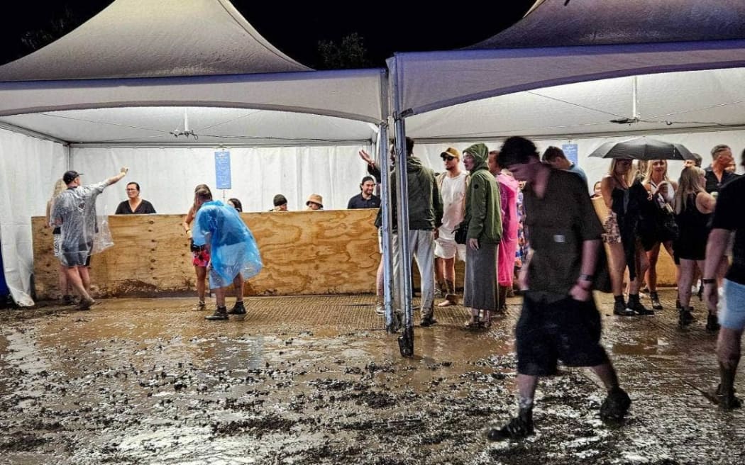 New Year's Eve festival-goers faced mud at the Highlife Festival at Ascension Wine Estate in Matakana.