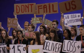 Climate activists  protest the negative effects of climate change at the UN climate summit COP27 in Sharm el-Sheikh, Egypt on November 19, 2022.